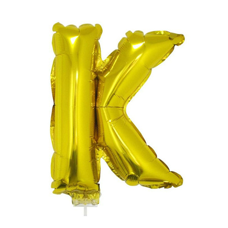 Golden inflatable letter balloon K on a stick