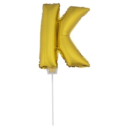 Golden inflatable letter balloon K on a stick