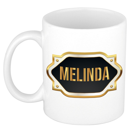 Naam cadeau mok / beker Melinda met gouden embleem 300 ml